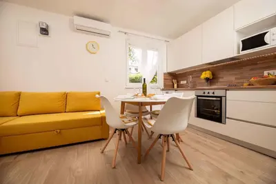 Image de Appartement de vacances avec terrasse, WiFi, climatisation