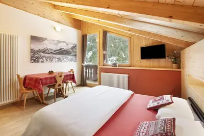 Image de Appartement 'Chalet Primula 14' avec vue sur la montagne, jardin partagé et Wi-Fi