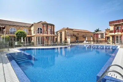 Image de Maison de vacances 'Sunrise Maspalomas' avec vue sur les montagnes, piscine partagée et Wi-Fi