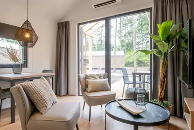 Image de Jolie tuny house avec airco, dans un parc de vacances, à 12 km. depuis Eindhoven