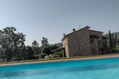 Tuscan-style villa with private pool and 2500 acres of garden and land.