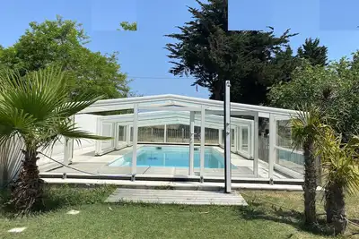 Image de Villa vue parc plage au bout du jardin.