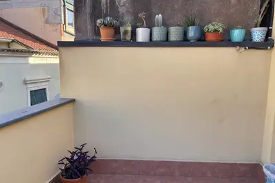 Image de Cozy 2-bedroom house downtown Acitrezza with a picturesque rooftop patio.