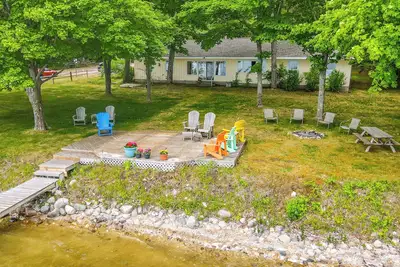 Image de Waterfront Torch Lake Cottage w/ Dock & Fire Pit!