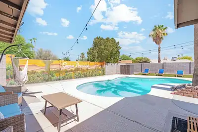 Image de Boho style oasis in north Phoenix with a beautiful pool and game room.