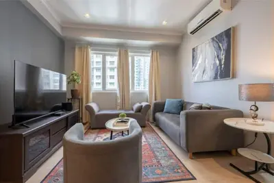 Image de New! Cozy 2 Bedroom in Bgc. Fast Wi-Fi and 58\" Tv\n