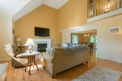 Image de Cape Cod pet friendly home with deck with gas grill, back yard patio with fire pit, and central Ac