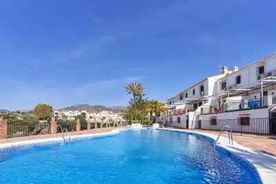Image de Appartement \"Almijara 2\" avec piscine commune et Wi-Fi
