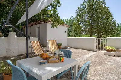 Image de GuestHost - Nice apartment that hosts up to 2 people, located in an old farmhouse dating back to the 19th century, furnished with taste and meticulous recovery of the original materials. The accommodation is located in Cozzana, a quiet and verdant distri