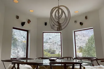 An immaculate retreat nested on a rock in June Lake, with 360º mountain view.