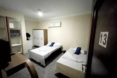 Image de Quarto Familiar 13, com tv, Frigobar, Ventilador e Café da Manhã Incluso
