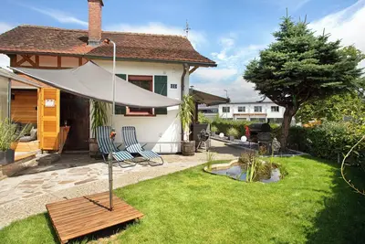 Image de Maison de vacances 'Die Bahnstation' avec terrasse privée, jardin privé et Wi-Fi