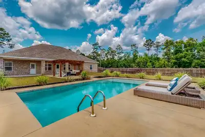 Image de Nautical-themed retreat with a saltwater pool, fire table, full kitchen, and Ac