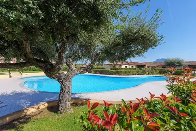 Image de Appartement de vacances \"Melograno\" avec piscine partagée, terrasse privée et climatisation