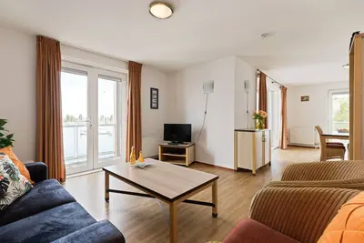 Image de This nice 4-pers. corner-apartment on the 1st floor with unique harbor view near the beach.