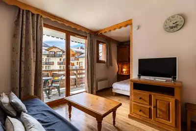 Image de Warme Wohnung im Herzen des Resorts.
