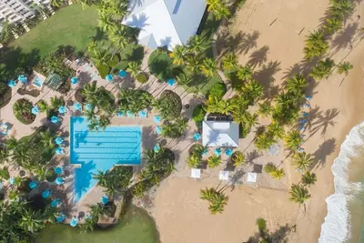 Sunny Condo, and Pool Opens to Beach Beyond
