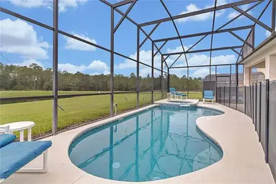 Image de 6 Br / 4, 5 Bath + Pool/Spa + Game Room / Less than 4 miles from Disney