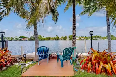 Image de Inviting waterfront home with pool, enclosed yard, firepit, W/D, & dog-friendly