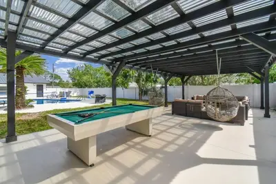 Image de Resort Style 5bedrooms/2bathrooms home with pool, Games and a pool table.