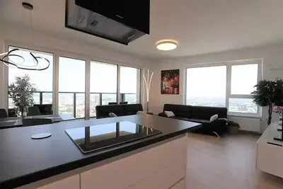 Image de View of the city from the 30th floor, parking included in the price<br>