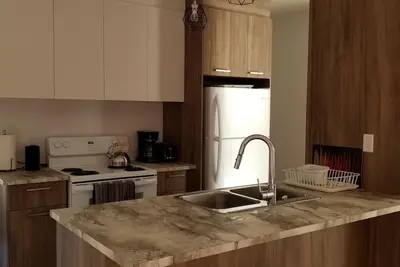 Image de Condo 10 minutes from the Mont Tremblant ski slopes ( Pet-Friendly)