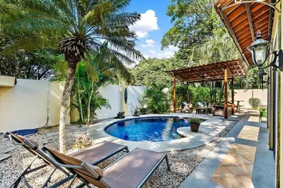 Image de Inviting Home with Colorful Decor and Private Backyard Oasis with a Swimming Poo