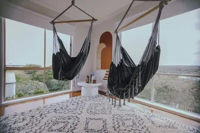 Image de The Hangout King Beds Hammock Chairs with a View