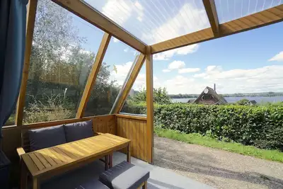 Image de Modernes Nurdachhaus in Ruhiger Feriensiedlung Direkt am Wittensee