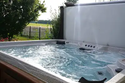 Image de Family Friendly 4 Bedroom, 3 Bath Family, Hot Tub and playground. Sleeps 12