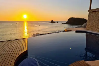 Beachfront Luxury -180° Bay Views -\nINFINITY Pool And Stunning Outdoor Spaces