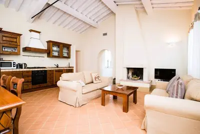 Image de Elegant first floor apartment of 84 m2 composed of a large living room with fireplace, kitchen complete with dishwasher, microwave oven, electric oven, coffee machine, kettle, fridge and freezer. A double bedroom and a single bedroom, both with private ba