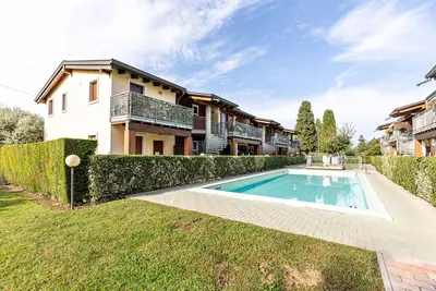 Image de Appartement 'Résidence La Corte' avec piscine partagée, balcon et climatisation