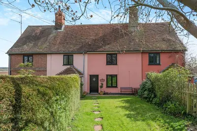 Image de A humble, cute country cottage with views over the river.