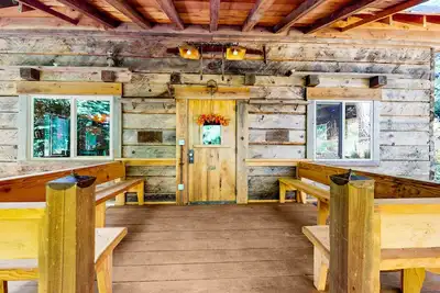 Charming woodland cottage with 2 covered porches, wood stove, treehouse, firepit