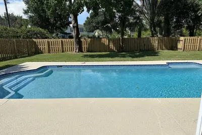 The Pink Flamingo rental with a large pool for relaxing in the sunshine