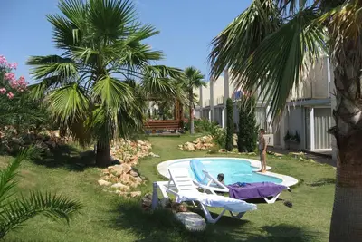 Image de Appartement de vacances avec beau jardin et diverses piscines