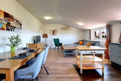 Image de Appartement de vacances avec vue sur la mer et jardin à usage commun