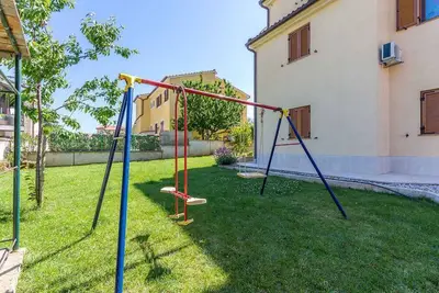 Image de Appartement de vacances avec un beau jardin Ă usage commun