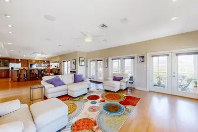 Image de Riverfront home near beach with dock, elevator, panoramic river views, & deck