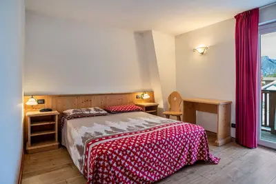 Image de Appartement 'Giongo Residence Aparthotel 101' avec vue sur la montagne, terrasse partagée et Wi-Fi