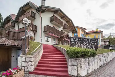 Image de Appartement 'Giongo Residence Aparthotel 204' avec vue sur la montagne, terrasse partagée et Wi-Fi