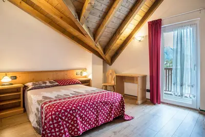 Image de Appartement 'Giongo Residence Aparthotel 104' avec vue sur la montagne, terrasse partagée et Wi-Fi