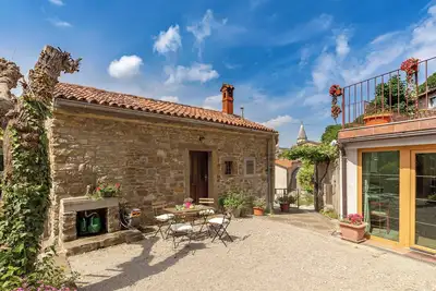 Old Istrian house under the rock in Osp\n\n