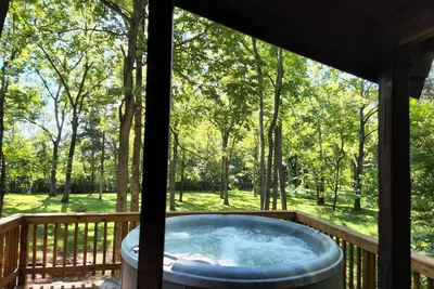 Adorable river front  cabin, with hot tub on the River