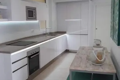 Image de Beach front new renovated apartment with WiFi! !