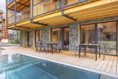 Image de # 3a mit Sauna & Pool by Interhome