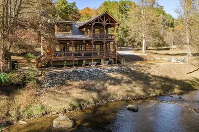 Image de Cabin on Water  Scenic Fly Fishing Firepit Games