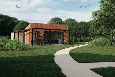 Image de Lodge avec vue sur le lac et climatisation, près du Maasduinen