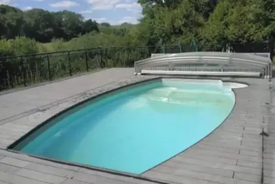 Image de Homerez - Chalet chaleureux à Louâtre avec piscine partagée